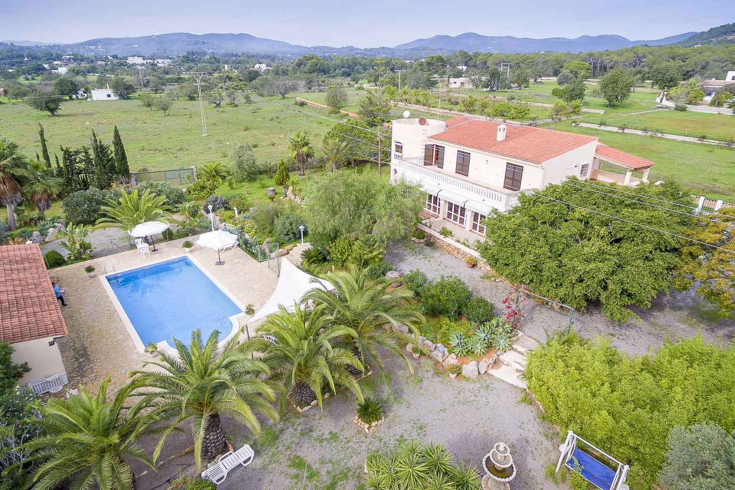 general view of a rental house with pool zone in ibiza